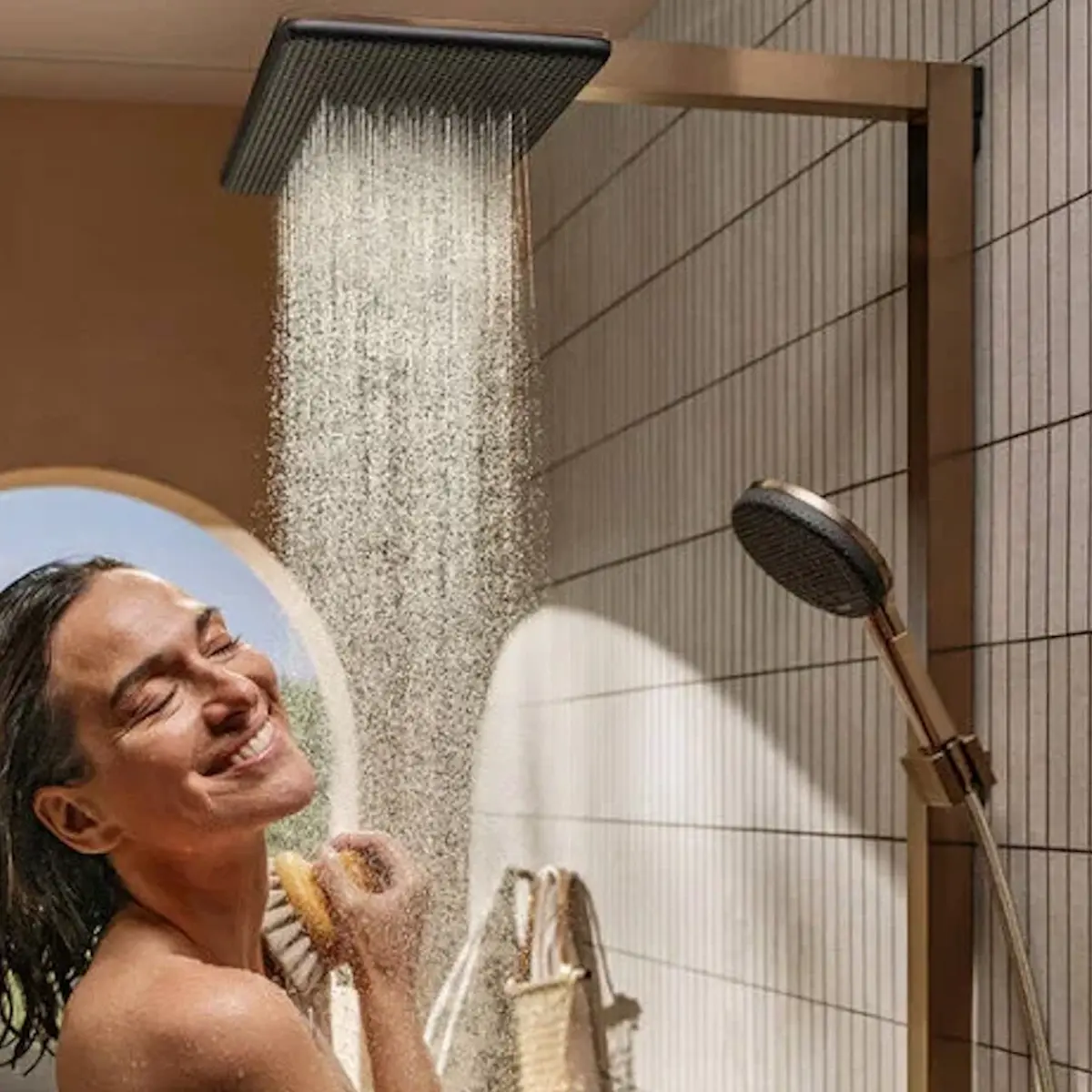 raindance-alive_showerpipe_brushed-bronze_part-ambiance_with-model_16x9_1000_640